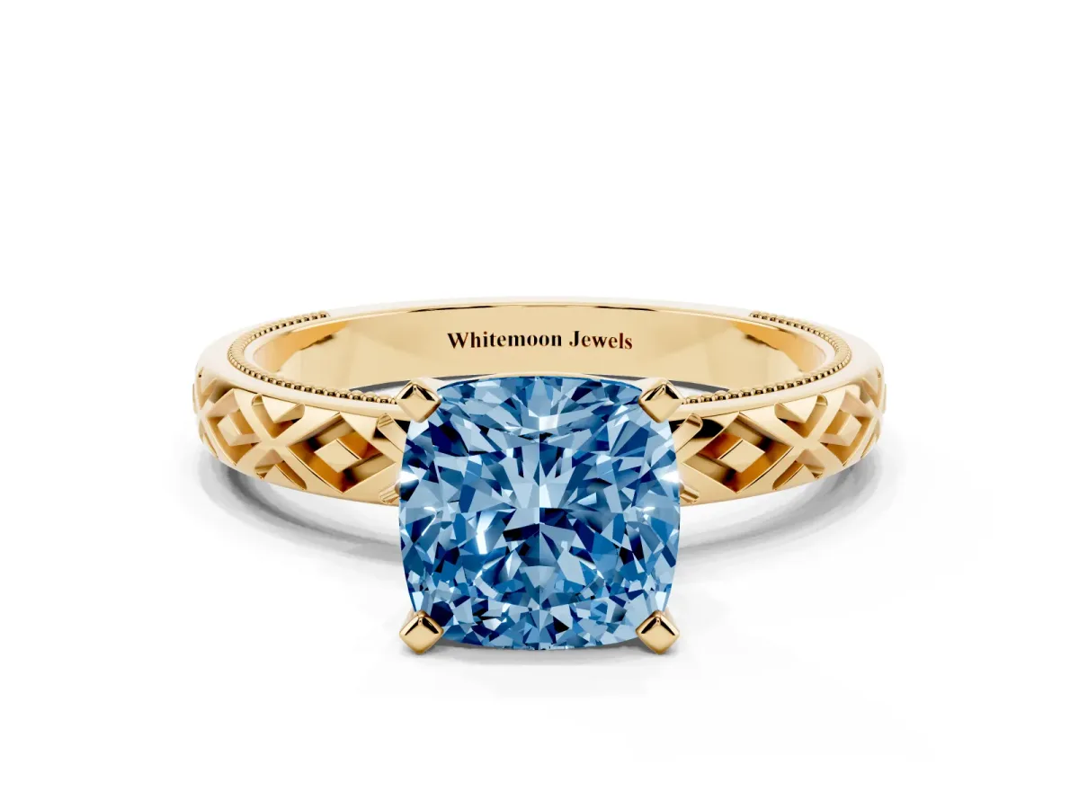 Fancy Blue Cushion Cut Solitaire Diamond Ring with Milgrain and Black Enamel X Pattern Band Yellow gold