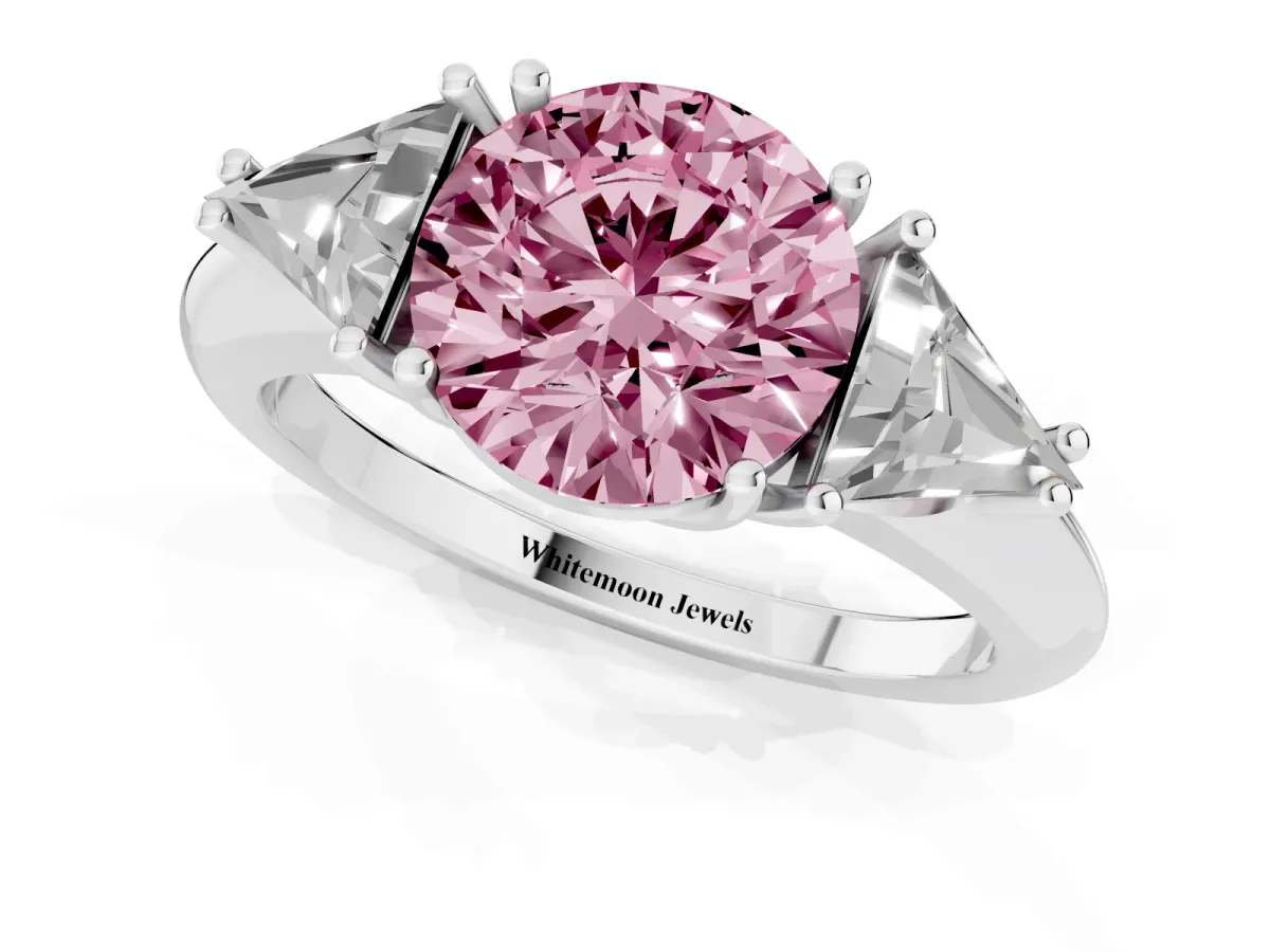 Fancy Pink Three-Stone Round Cut Diamond Engagement Ring with Trillion Side Stones and Prong Setting Silver