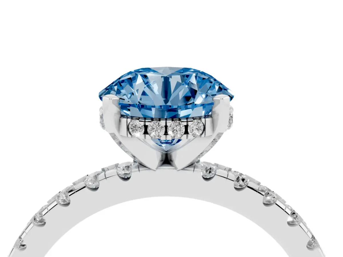 Fancy Blue Round Cut Diamond Solitaire Ring with Round Pavé Band and Four-Prong Setting Silver