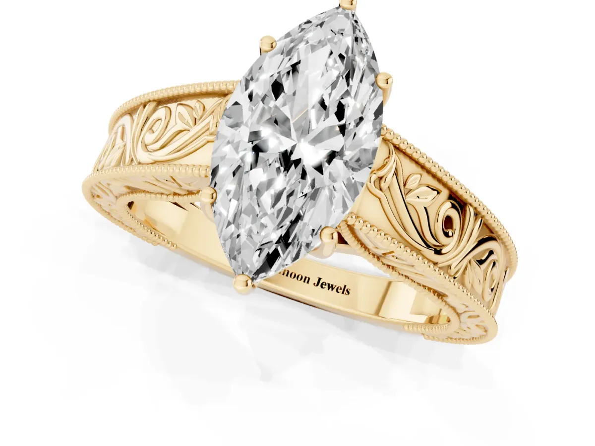 Marquise Cut Diamond Solitaire Ring with Engraved Band and Four-Prong Setting Yellow gold