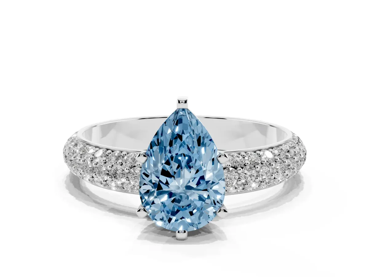Fancy Blue Pear Cut Diamond Solitaire Ring with Prong Setting and Pavé Band Silver