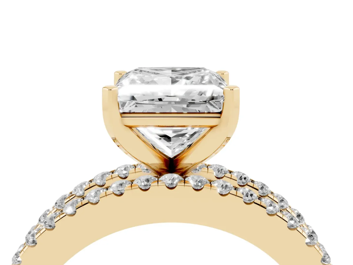 Princess Cut Diamond Solitaire Ring with Pavé and Channel Set Band Yellow gold