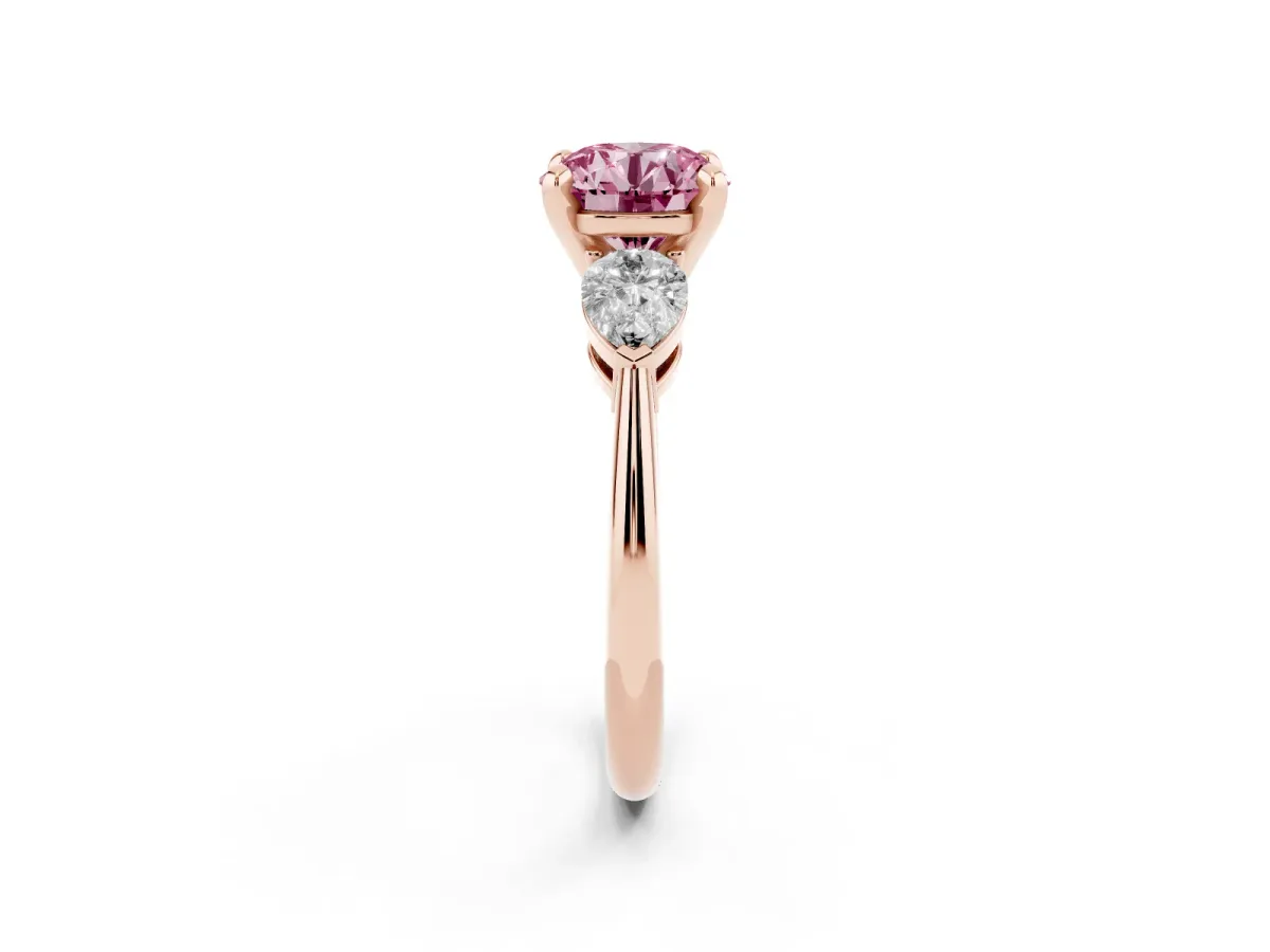 Fancy Pink Three-Stone Round Cut Diamond Ring with Pear Side Stones and Four-Prong Setting Rose gold