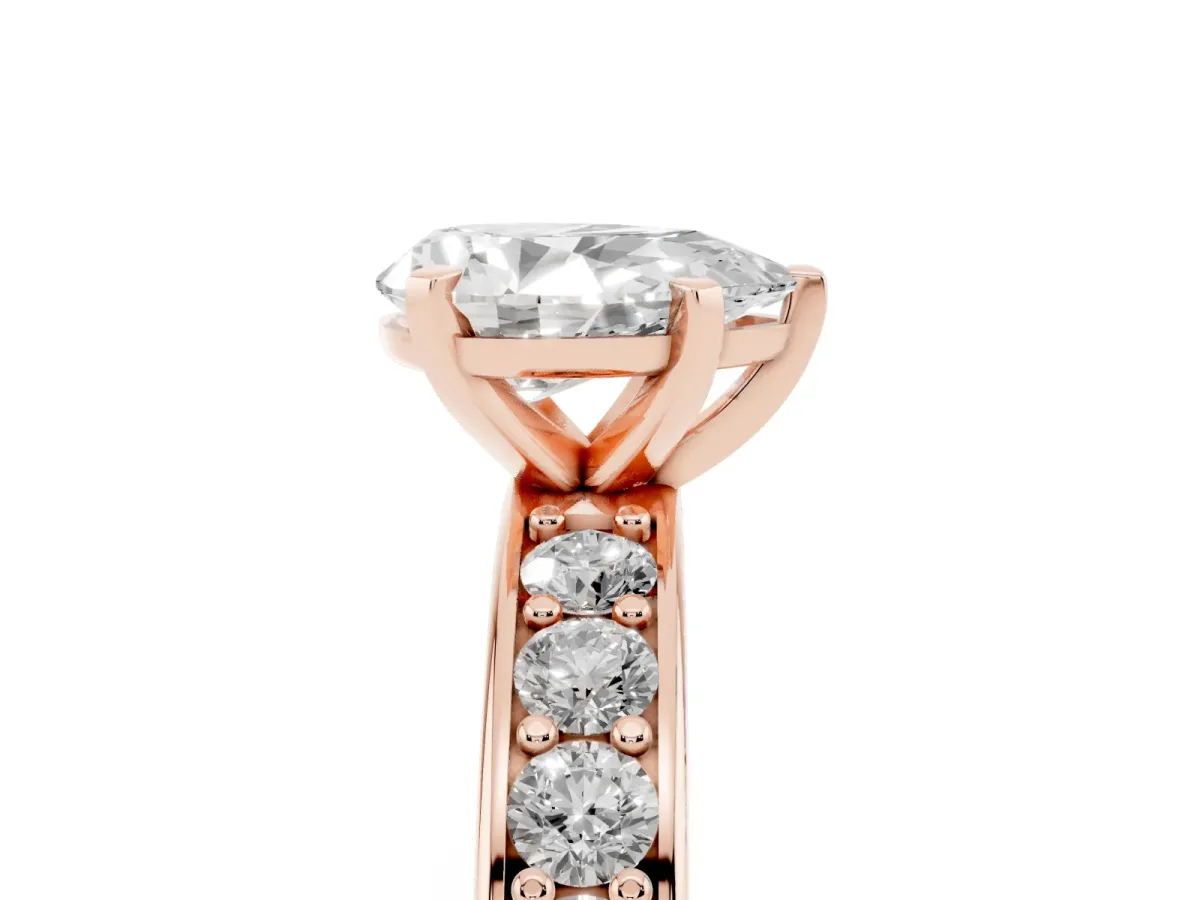 Pear Cut Diamond Engagement Ring with Channel Set Round Band and Prong Setting Rose gold