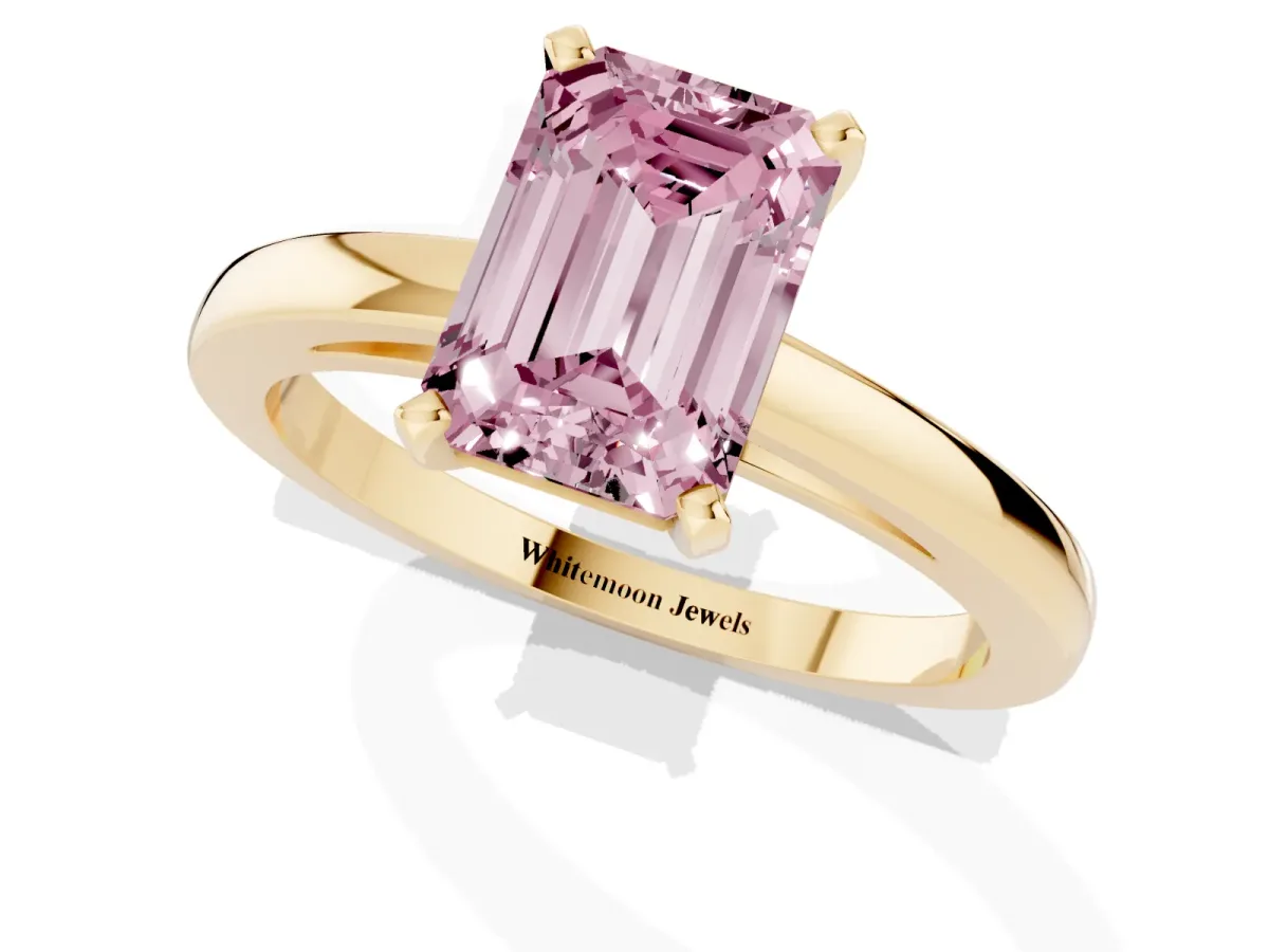 Fancy Pink Emerald Cut Solitaire Diamond Engagement Ring with Four-Prong Setting on a Classic Band Yellow gold