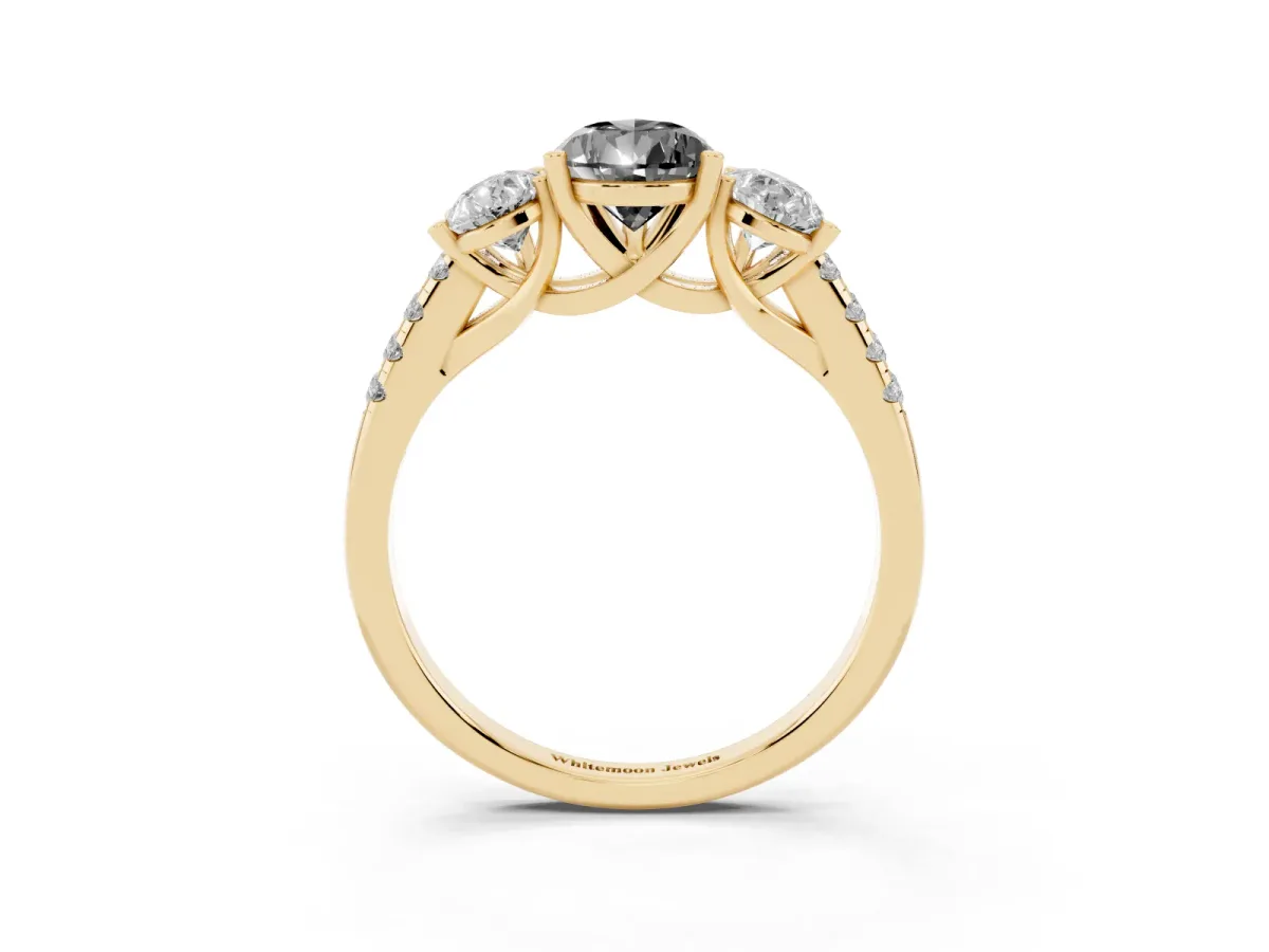 Fancy Black Three-Stone Pear Cut Diamond Ring with Round Pavé Band and Prong Setting Yellow gold