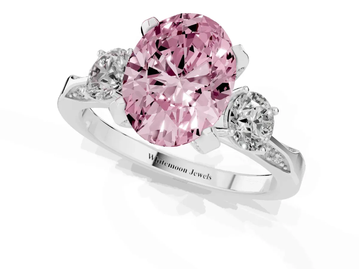 Fancy Pink Oval Cut Brilliant Three-Stone Diamond Ring with Pavé Band and Four-Prong Setting Platinum
