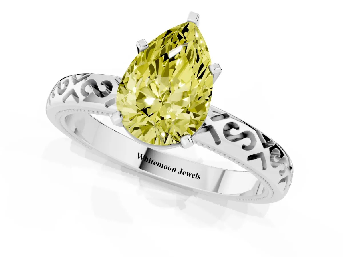 Fancy Yellow Pear Cut Solitaire Engagement Ring with Scrollwork Band and Four-Prong Setting Silver