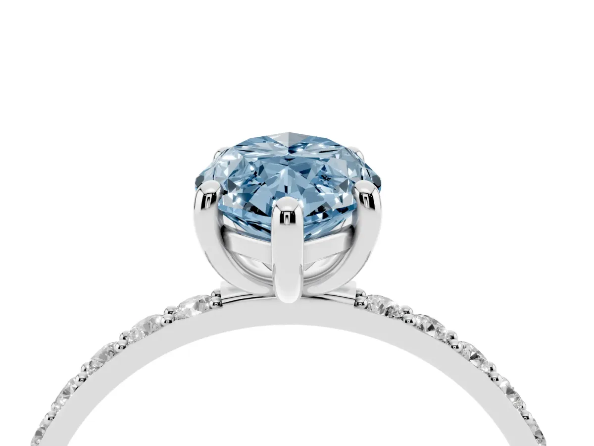 Fancy Blue Marquise Cut Diamond Solitaire Ring with Round Pavé Band and Prong Setting Silver