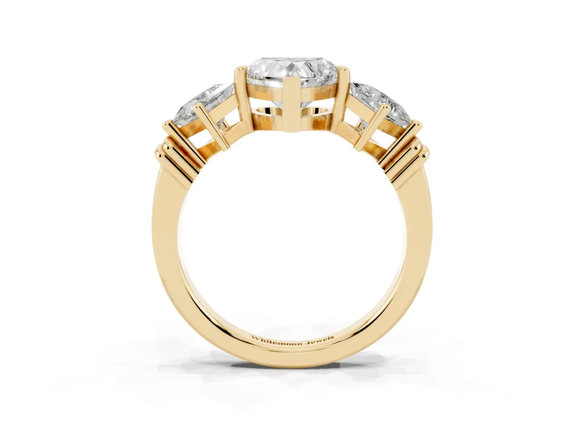 Three-Stone Heart Cut and Princess Cut Diamond Ring with Channel Band and Four-Prong Setting Yellow gold