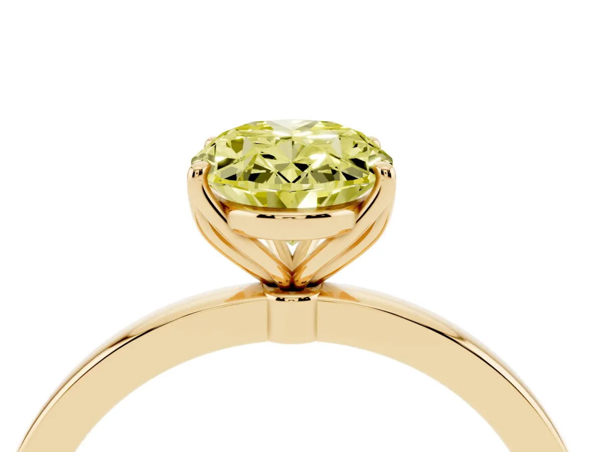 Fancy Yellow Oval Cut Diamond Solitaire Ring with Thin Band and Prong Setting Yellow gold