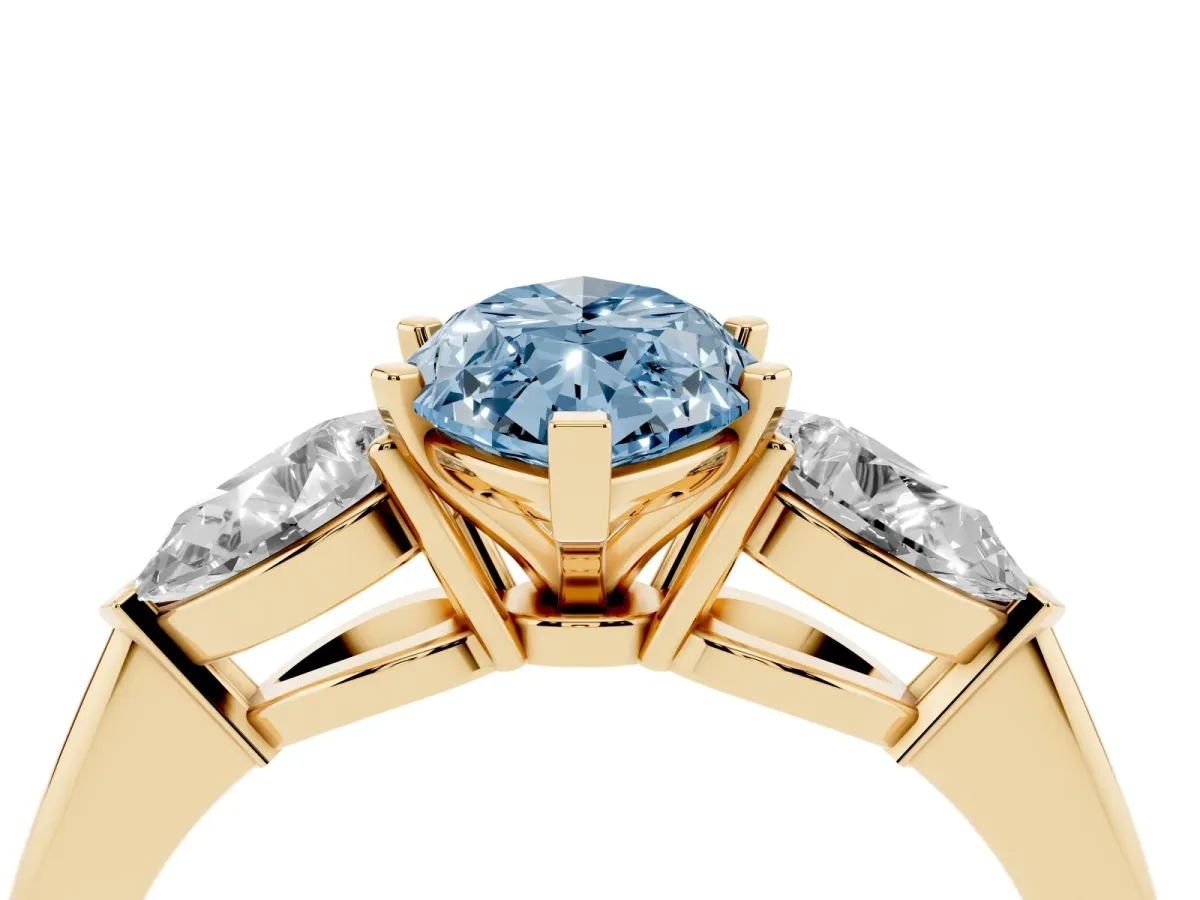 Fancy Blue Three-Stone Marquise Cut Diamond Ring with Pear Side Stones and Four-Prong Setting Yellow gold