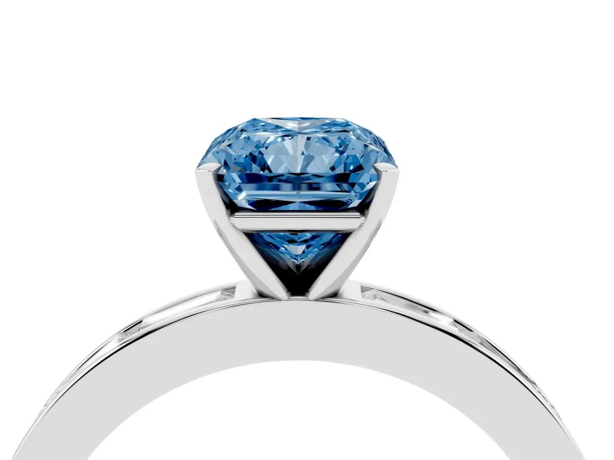 Fancy Blue Radiant Cut Solitaire Diamond Ring with Channel-Set Baguette Band and Four-Prong Setting Silver