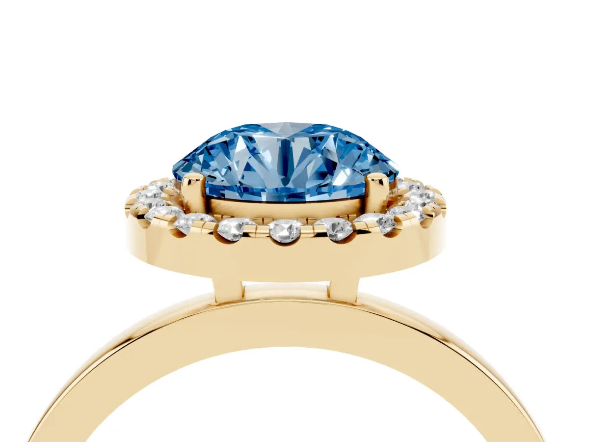 Fancy Blue Round Cut Halo Diamond Solitaire with Pavé Band and Four-Prong Setting Yellow gold