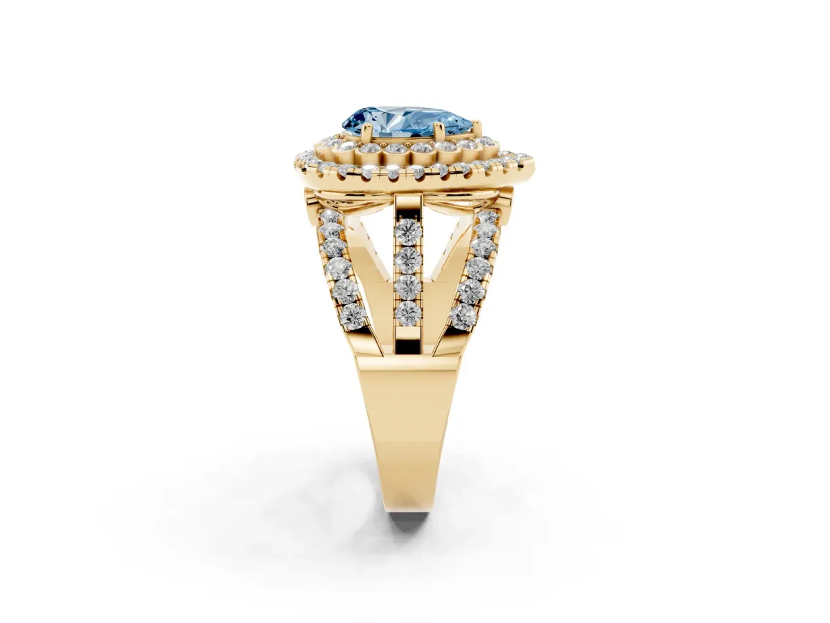 Fancy Blue Pear Cut Diamond Double Halo Ring with Round Pavé Split Shank and Prong Setting Yellow gold