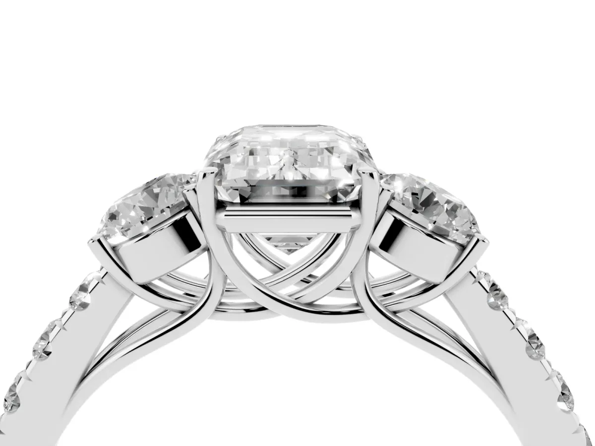 Emerald Cut Cut Diamond Three-Stone Ring with Round Side Stones and Pavé Band Platinum