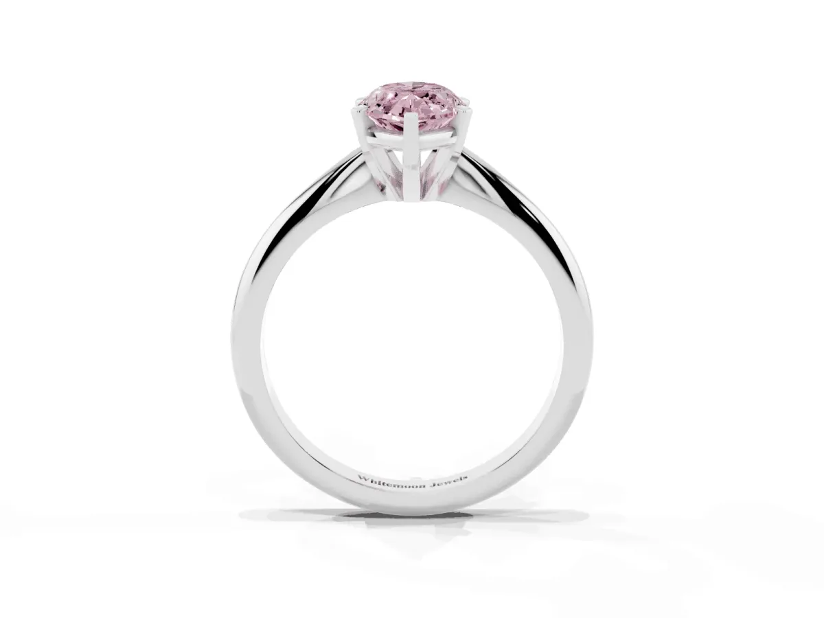 Fancy Pink Marquise Cut Cut Solitaire Ring with Four-Prong Setting on a Classic Band Silver