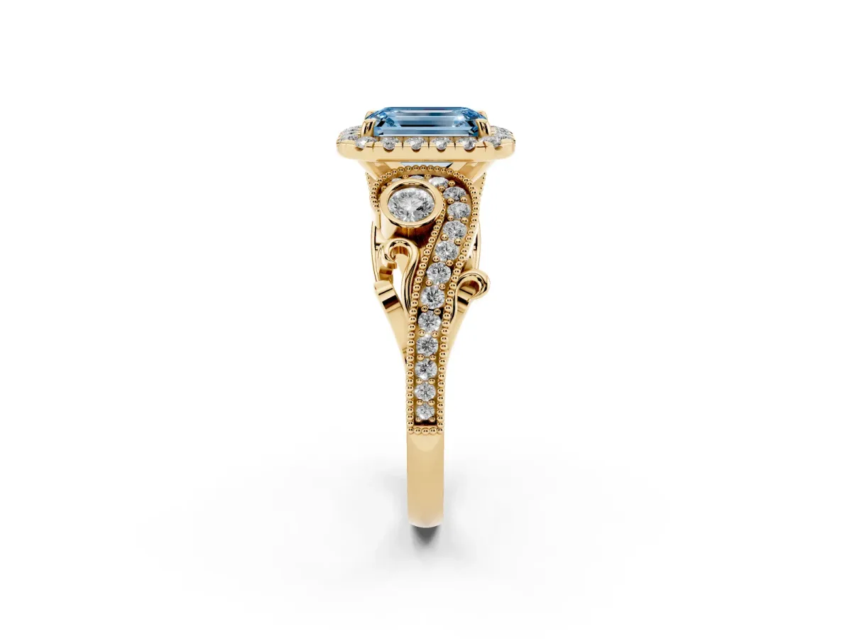 Fancy Blue Emerald Cut Halo Diamond Ring with Milgrain and Bezel Accents on a Split Shank Band Yellow gold