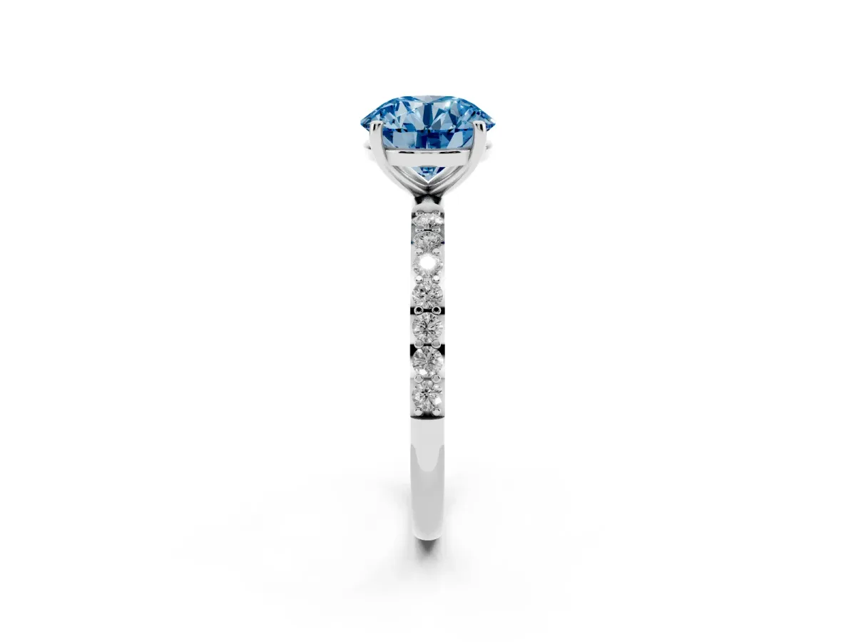 Fancy Blue Round Cut Diamond Solitaire Ring with Round Pavé Shoulders and Prong Setting Silver