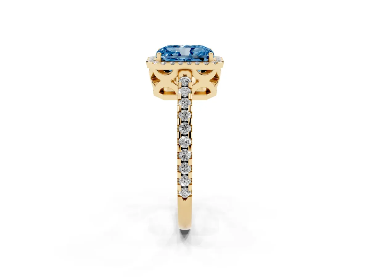 Fancy Blue Radiant Cut Diamond Halo Engagement Ring with Pavé Band and Prong Setting Yellow gold
