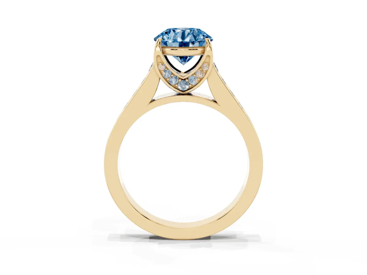 Fancy Blue Round Cut Brilliant Cut Diamond Engagement Ring with Pavé Band and Four-Prong Setting Yellow gold