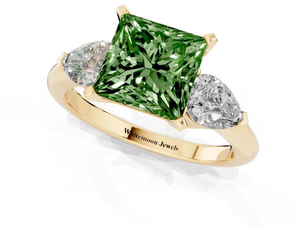 Fancy Green Three-Stone Princess Cut Diamond Ring with Pear Side Stones and Four-Prong Setting Yellow gold