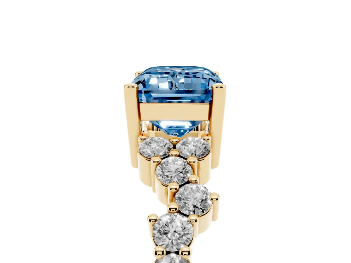 Fancy Blue Emerald Cut Diamond Scattered Round Accent Ring with Prong Setting Yellow gold