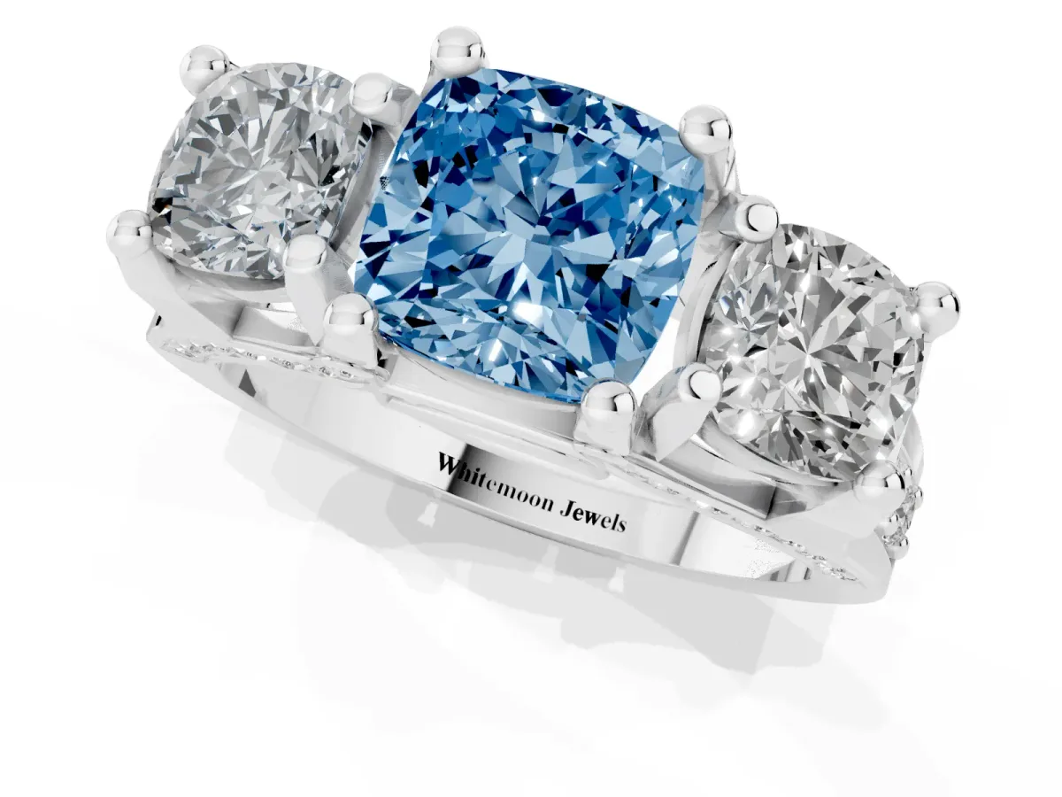 Fancy Blue Cushion Cut Diamond Three-Stone Ring with Channel Set Band and Four-Prong Setting Silver