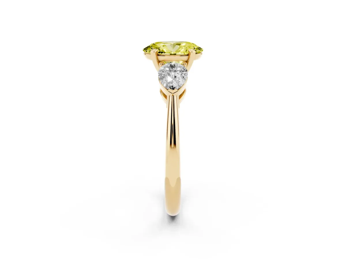 Fancy Yellow Three-Stone Oval Cut Diamond Ring with Pear Side Stones and Four-Prong Setting Yellow gold