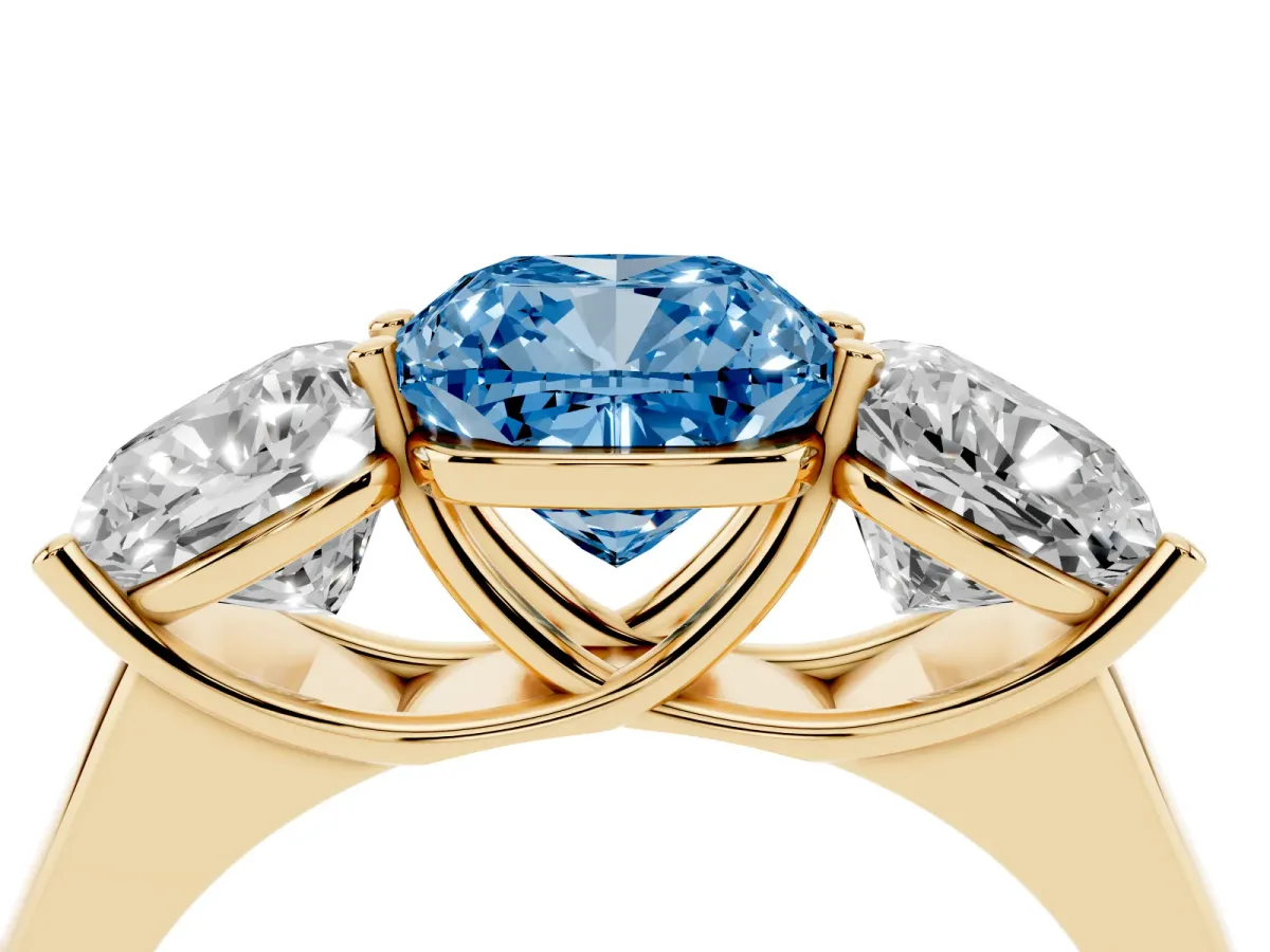 Fancy Blue Cushion Cut Three-Stone Diamond Ring with Prong Setting on a Classic Band Yellow gold