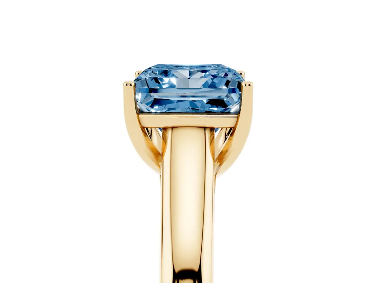 Fancy Blue Princess Cut Solitaire Engagement Ring with Tapered Band and Four-Prong Setting Yellow gold