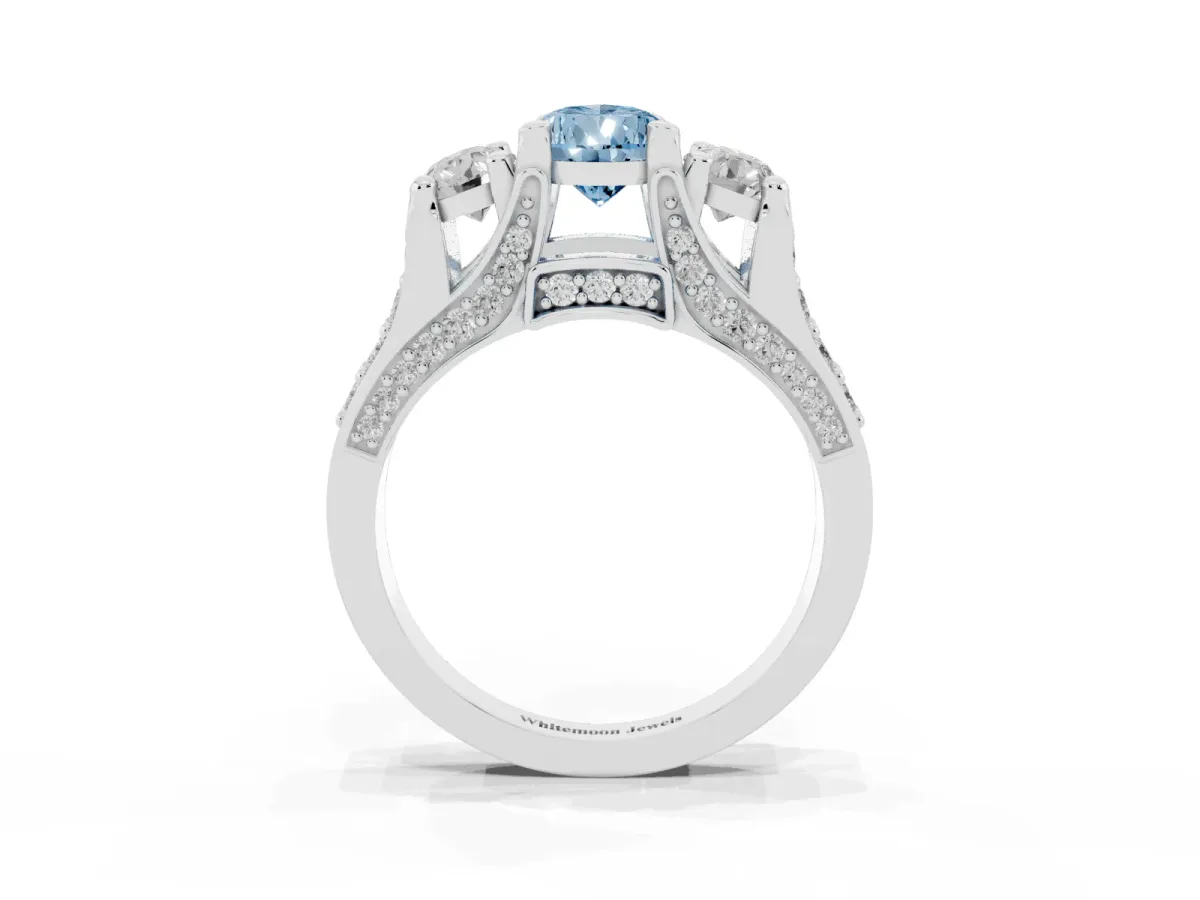 Fancy Blue Pear Cut Diamond Three-Stone Ring with Channel Set Band and Four-Prong Setting Silver