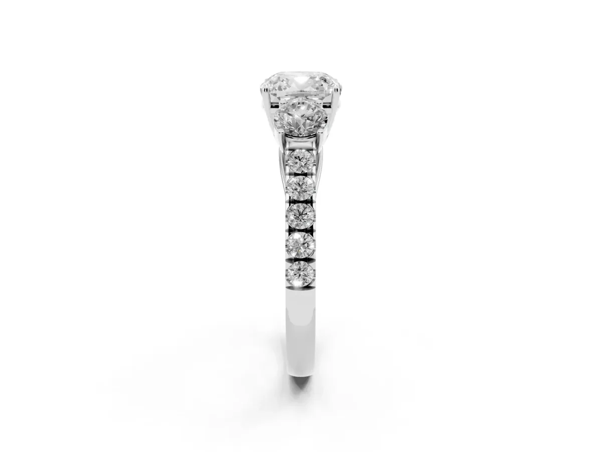 Cushion Cut Cut Diamond Three-Stone Ring with Round Side Stones and Pavé Band Platinum