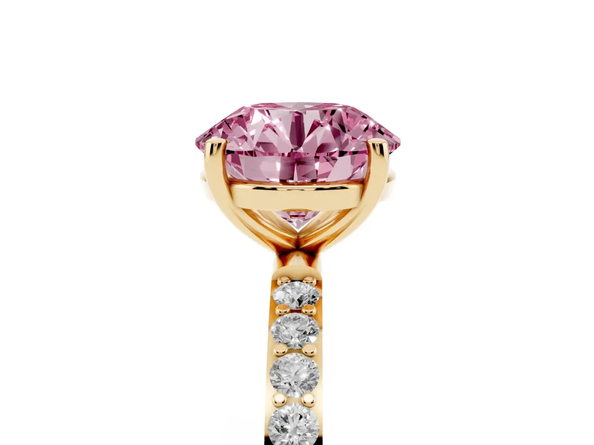 Fancy Pink Round Cut Diamond Solitaire Ring with Round Pavé Shoulders and Prong Setting Yellow gold