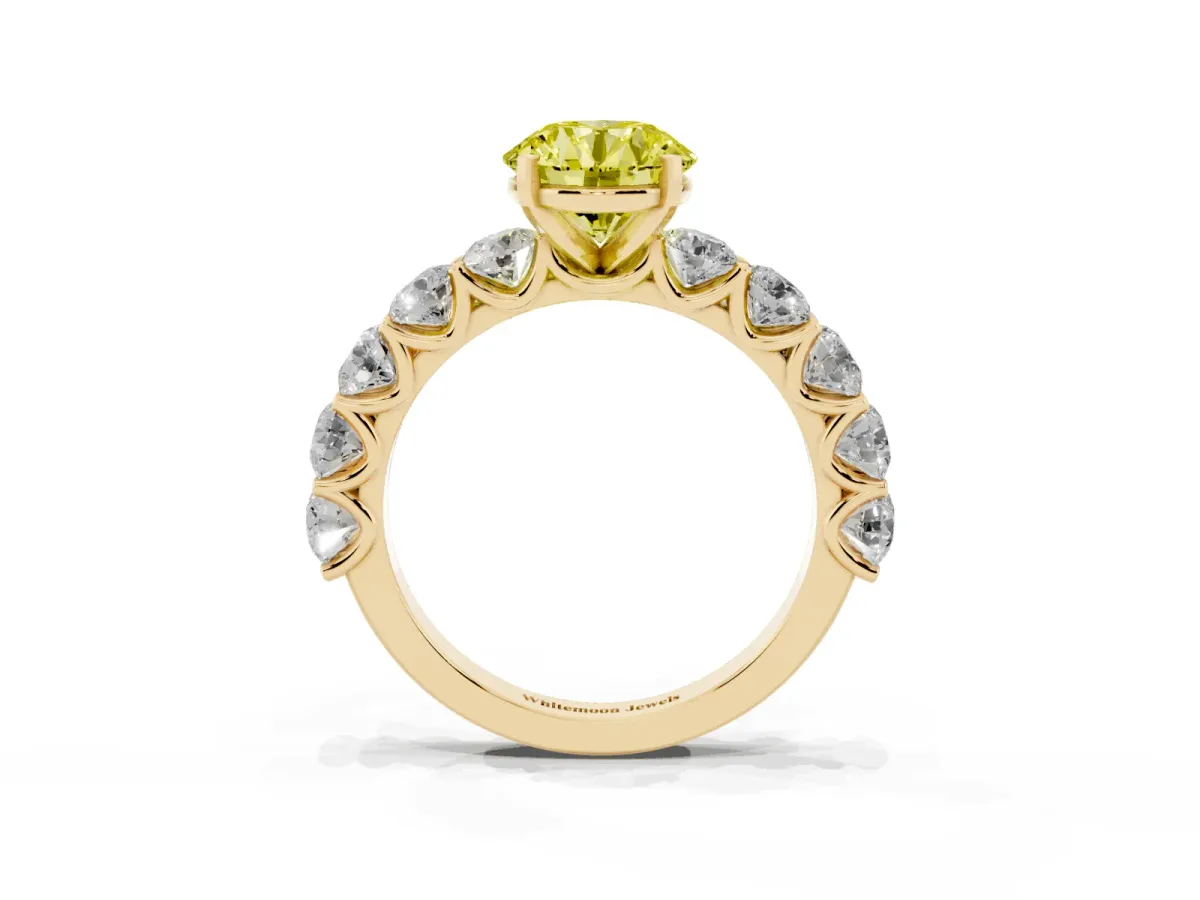 Fancy Yellow Round Cut Diamond Prong Setting with Side Stones on a Pave Band Yellow gold