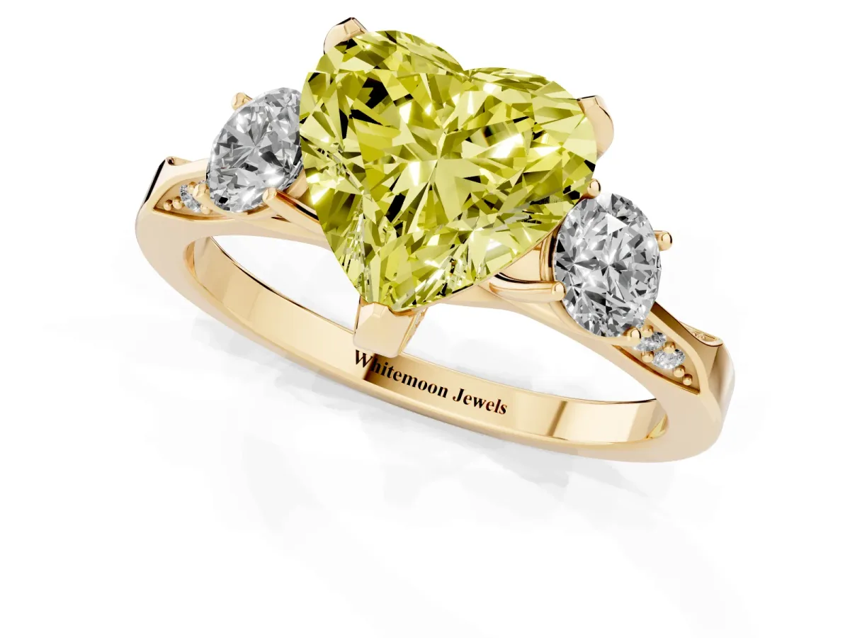 Fancy Yellow Heart Cut Brilliant Three-Stone Diamond Ring with Pavé Band and Four-Prong Setting Yellow gold
