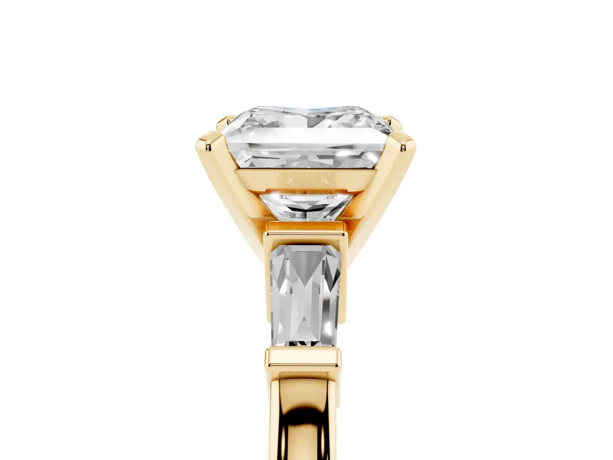 Princess Cut Cut Diamond Solitaire Ring with Tapered Baguette Accents and Four-Prong Setting Yellow gold