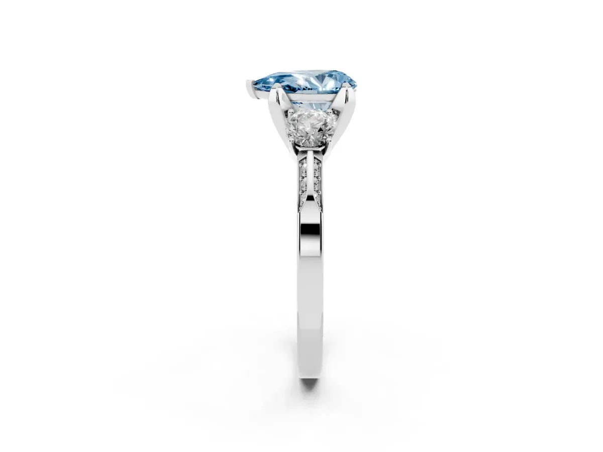 Fancy Blue Pear Cut Brilliant Three-Stone Diamond Ring with Pavé Band and Four-Prong Setting Silver