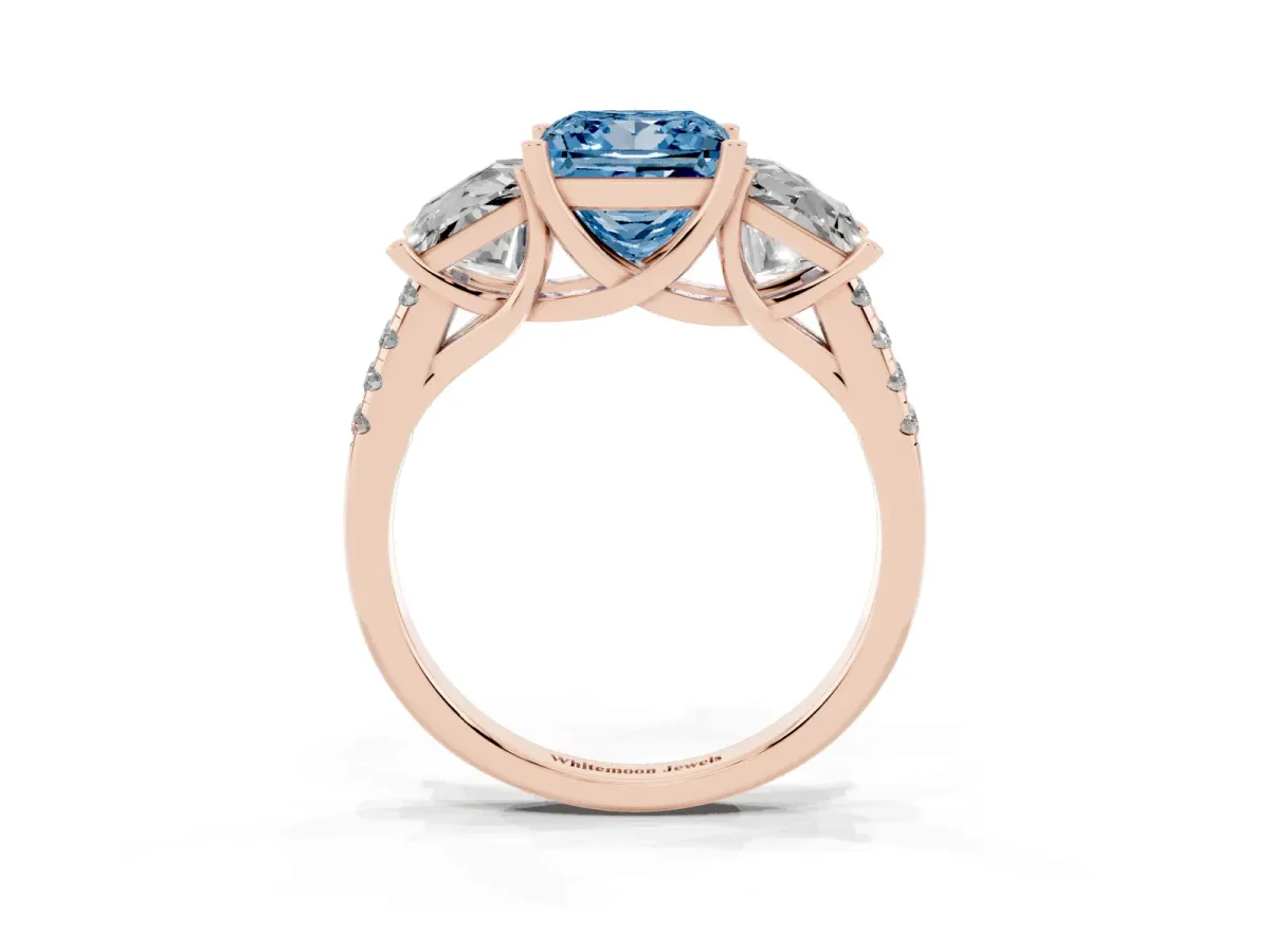 Fancy Blue Three-Stone Princess Cut Diamond Ring with Round Pavé Band and Prong Setting Rose gold