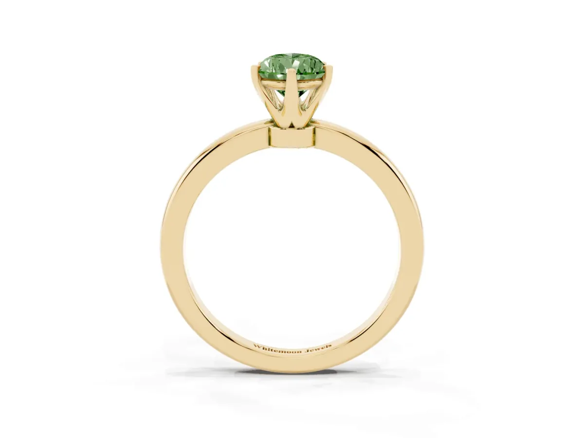 Fancy Green Pear Cut Solitaire Diamond Ring with Six-Prong Setting on a Classic Band Yellow gold
