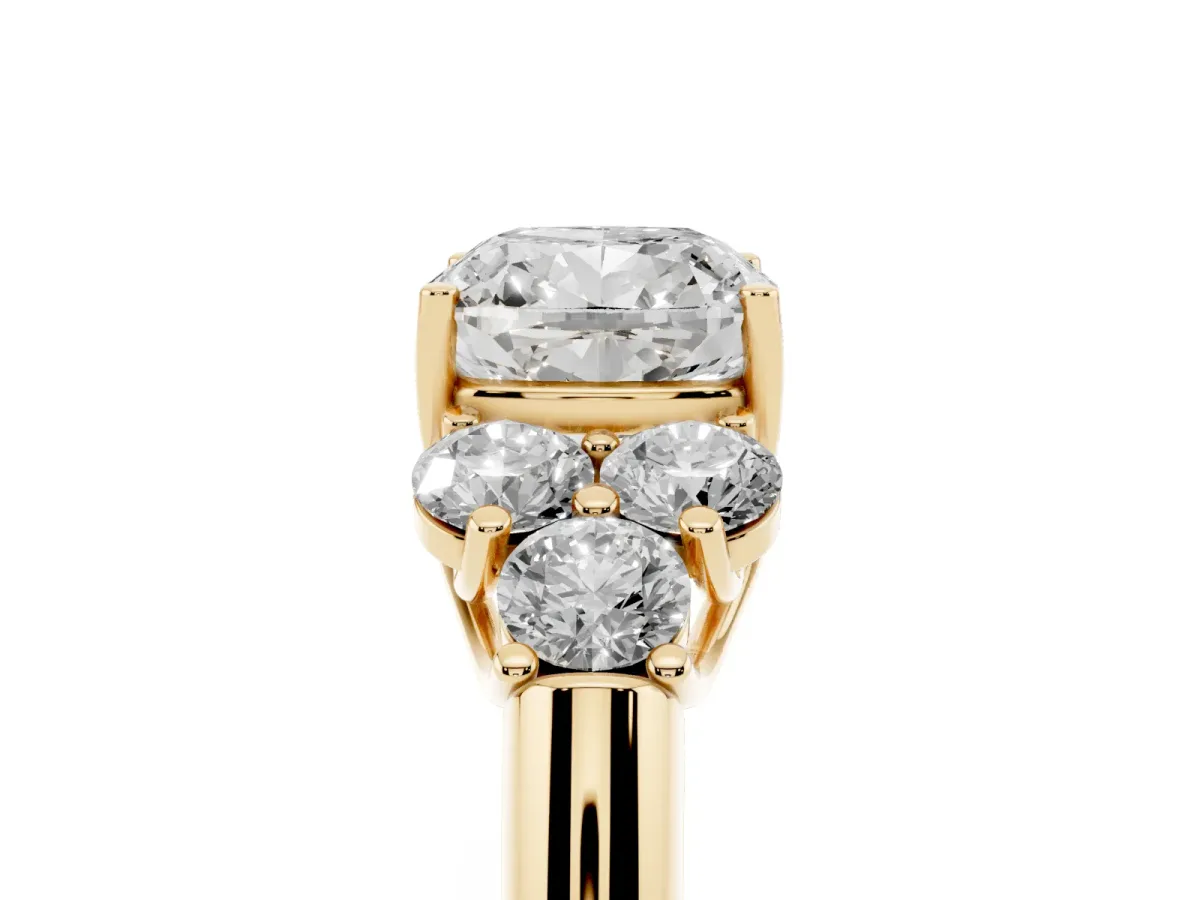 Cushion Cut Cut Diamond Cluster Ring with Round Accent Stones and Prong Setting on a Classic Band Yellow gold