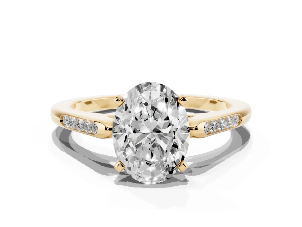 Oval Cut Diamond Solitaire Ring with Channel Set Round Band and Prong Setting Yellow gold