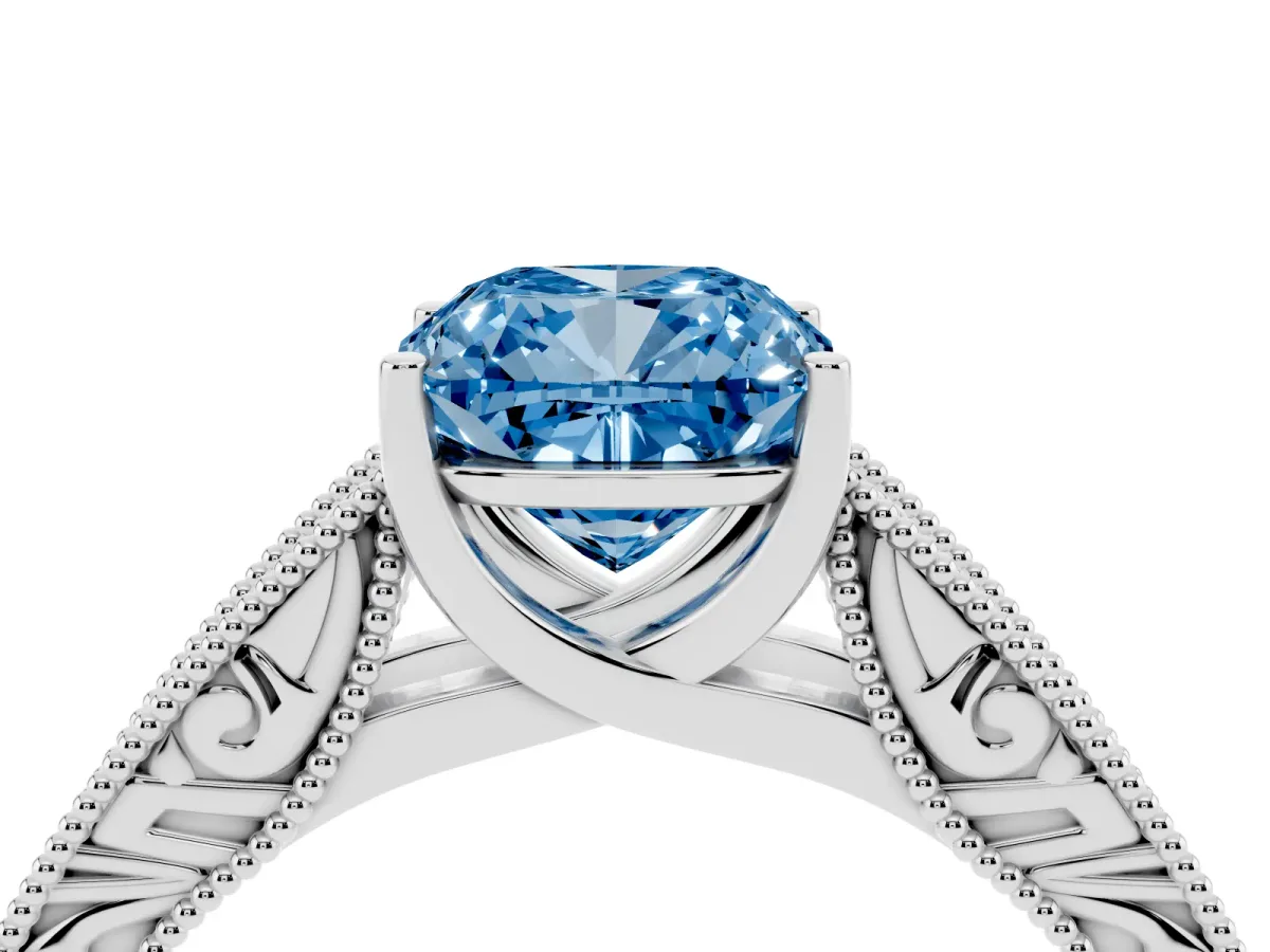 Fancy Blue Cushion Cut Diamond Solitaire Ring with Engraved Band and Four-Prong Setting Platinum
