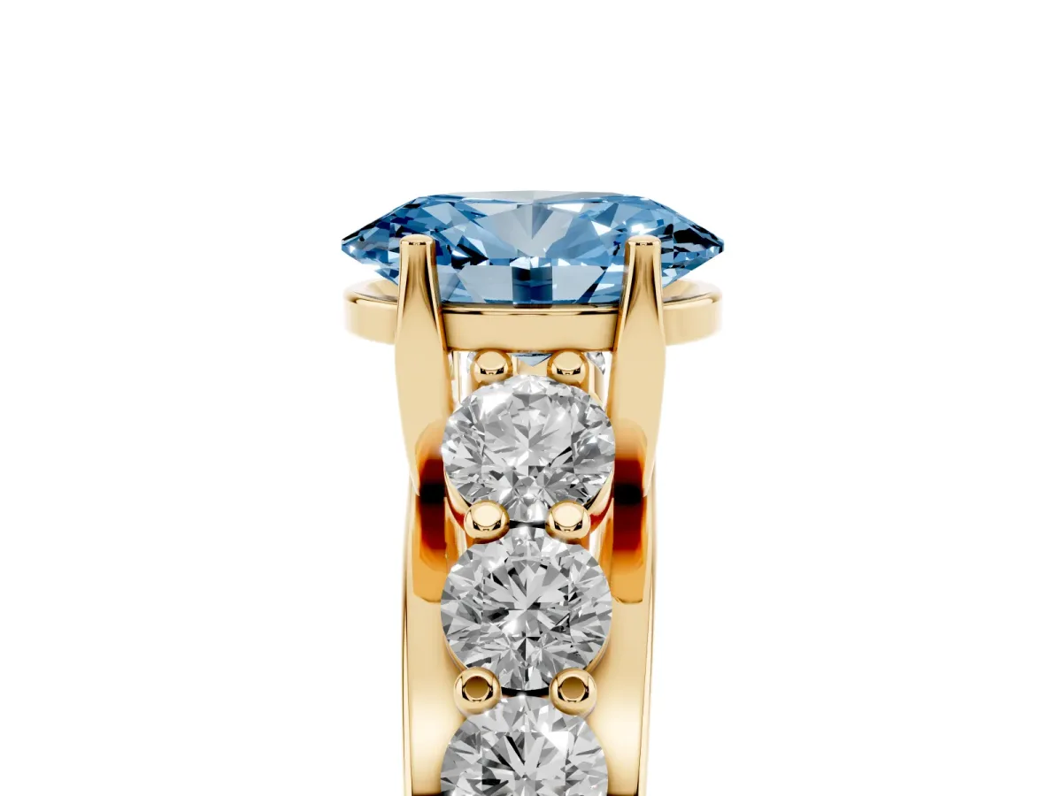 Fancy Blue Oval Cut Diamond Engagement Ring with Pavé Band and Four-Prong Setting Yellow gold