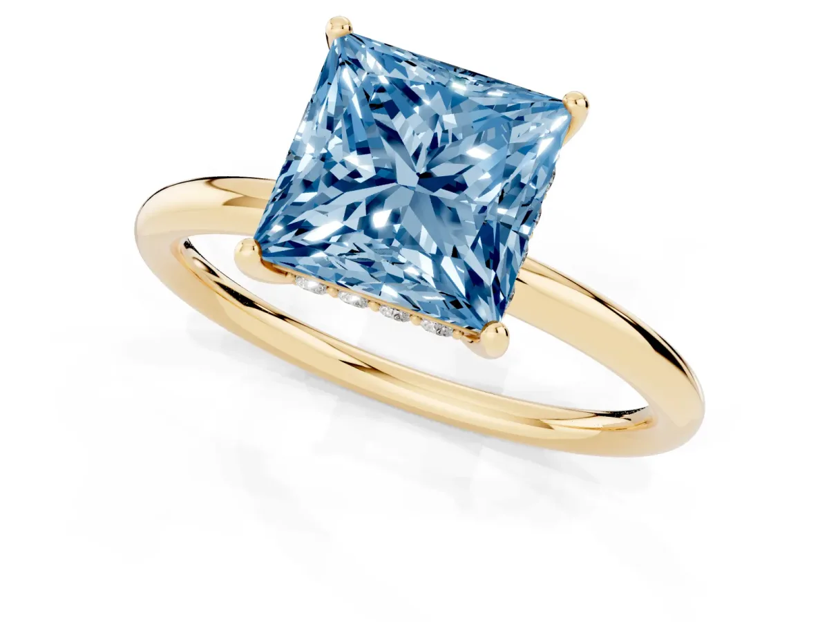 Fancy Blue Princess Cut Solitaire Diamond Ring with a Classic Band and Four-Prong Setting Yellow gold