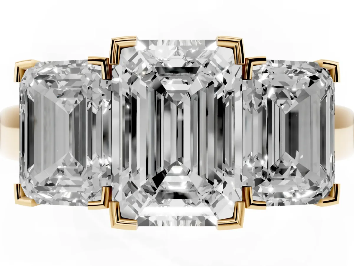 Three-Stone Emerald Cut Cut Diamond Ring with Channel Set Band and Four-Prong Setting Yellow gold