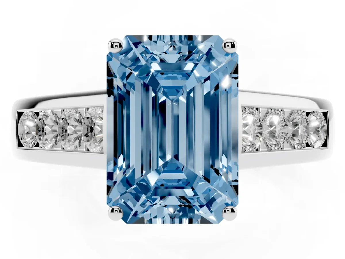 Fancy Blue Emerald Cut Brilliant Channel-Set Solitaire Ring with Four-Prong Setting Platinum