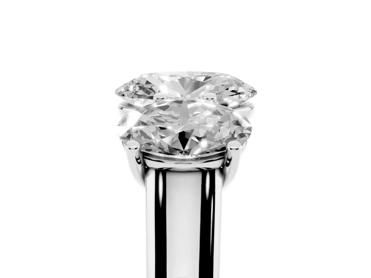 Oval Cut Three-Stone Diamond Ring with Prong Setting on a Classic Band Silver