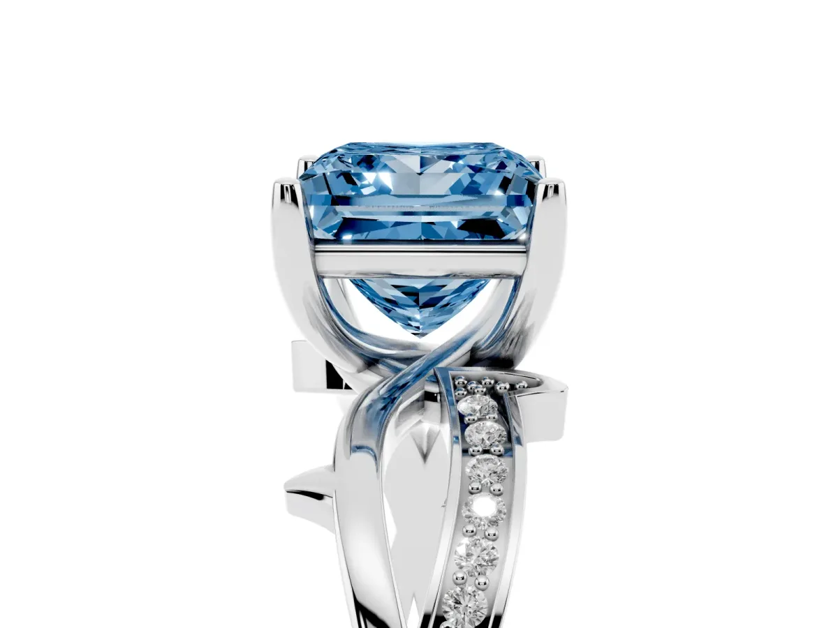 Fancy Blue Princess Cut Solitaire Twist Band with Pavé Accents and Four-Prong Setting Silver