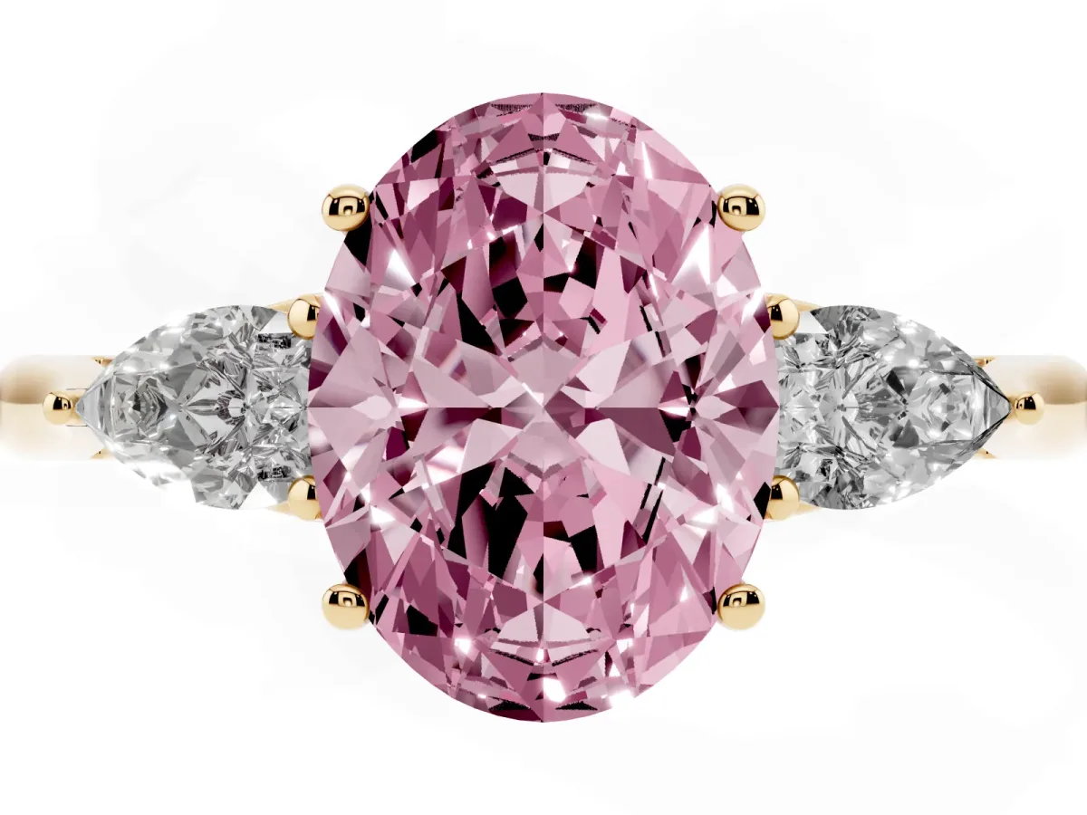 Fancy Pink Oval Cut Diamond Three-Stone Ring with Pear Side Stones and Prong Setting Yellow gold